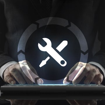 regclean pro registry cleaners software features man in black suit on wireless computer keyboard fixes system wrench and screwdriver symbol in a circle